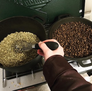 raw coffee beans and roasted coffee beans, side-by-side. The raw beans look pale green, and the roasted beans are dark brown.