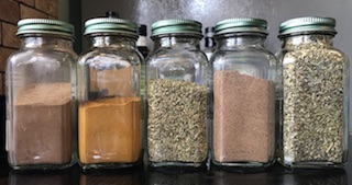 jars of herbs and spices arranged side by side