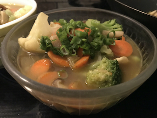 a bowl of soba noodle soup